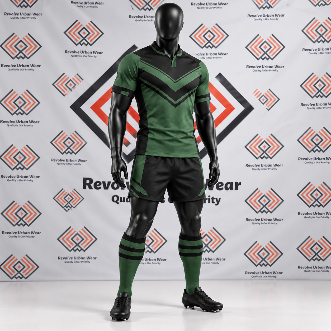 Green and black custom rugby union team kit with chevron chest design on a mannequin.