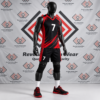 Custom black and red volleyball uniform with diagonal accents on a mannequin.