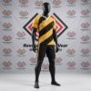 Custom yellow and black rugby uniform featuring diagonal torso stripes, a white rugby collar, and matching black shorts on a mannequin.