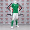 Green White Soccer Kit featuring a made to order green V-neck jersey with white shoulder stripes, white shorts, and green socks.