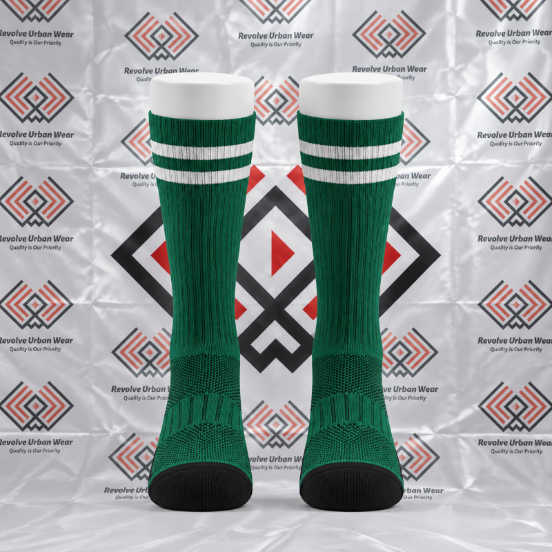 Custom green and white crew socks featuring ribbed cuffs and black reinforced toe panels on leg mannequins.