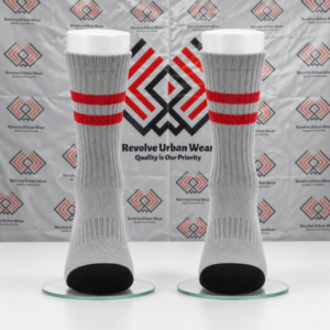 Custom grey and red crew socks featuring ribbed cuffs and black reinforced toe panels on leg mannequins.