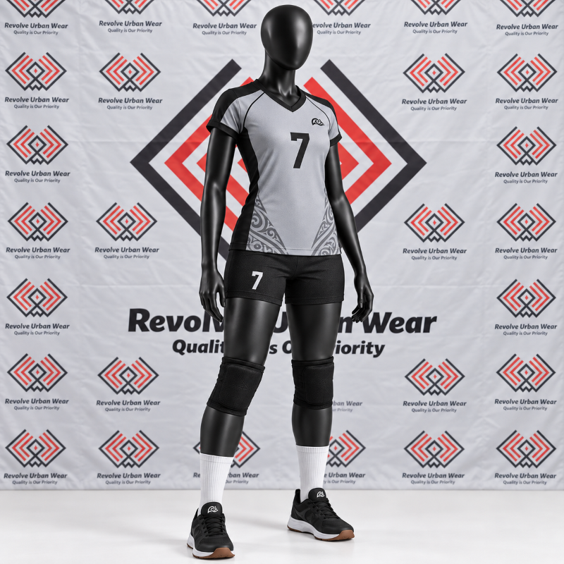 Grey Black Volleyball Kit featuring a made to order women's grey V-neck jersey with subtle tribal graphics and black athletic shorts on a mannequin.